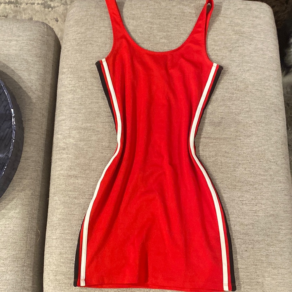 Skin tight red dress black and white stripe on side